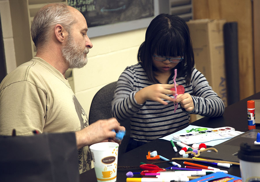 Art Ed student working with a child