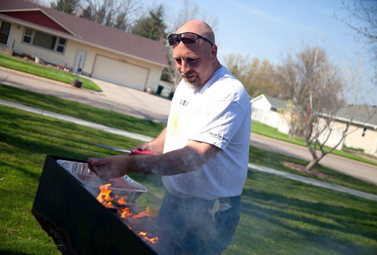 Profess Schuessler grilling some burgers