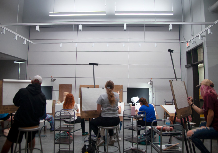 students drawing a still life