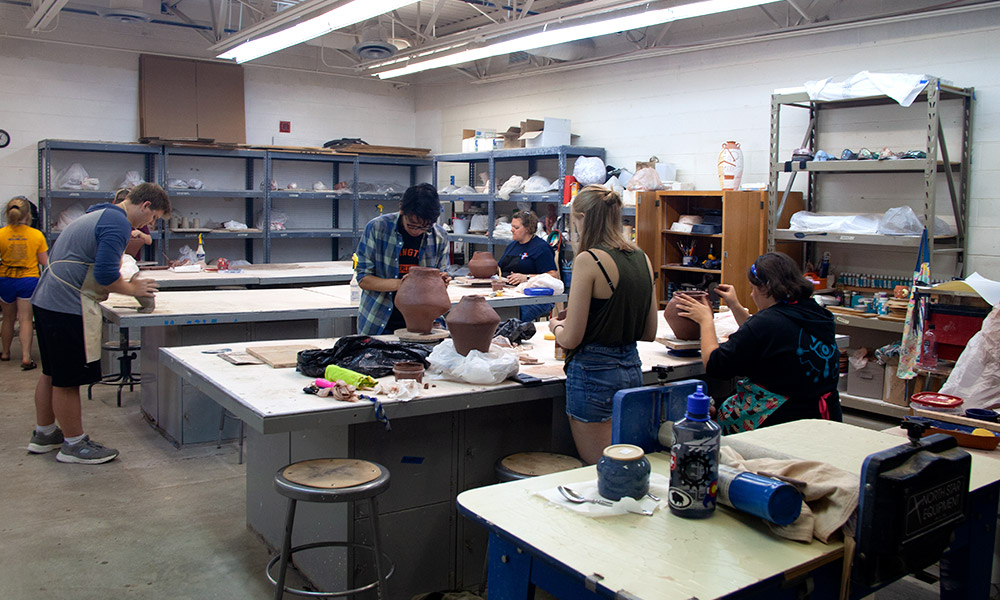 students working in ceramics class